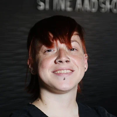 A headshot photo of Jules, a massage therapist at Axis Spine and Sport