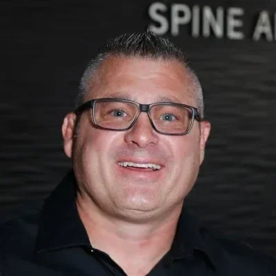 A headshot photo of chiropractor Billie Barefoot of Axis Spine and Sport