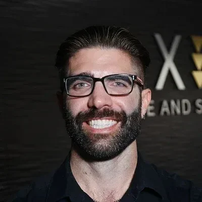 A headshot photo of chiropractor Cameron Call of Axis Spine and Sport